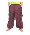 Pantalones Harem con estampado étnico y grandes bolsillos laterales púrpura.