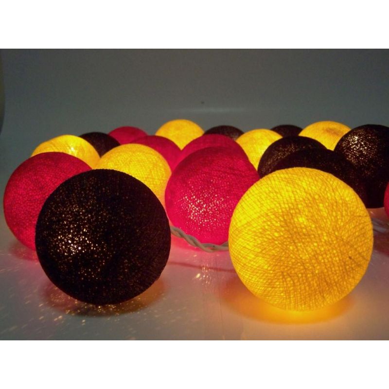 Christmas lights made of cotton balls, black red yellow